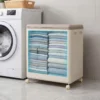 Aufbewahrungsbox für Kleidung mit Deckel und Rollen 122 L rollbarer Wäschekorb Grau