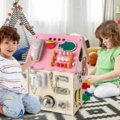 Kinder Spielhaus aus Holz mit Sinnesspielen und Stauraum für Kinder ab 3 J. Rosa