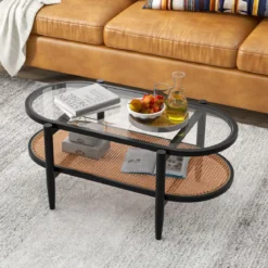 Ovaler Couchtisch Beistelltisch mit Glas Tischplatte & Rattan Ablage 102 x 56 x 47 cm Schwarz + Natur